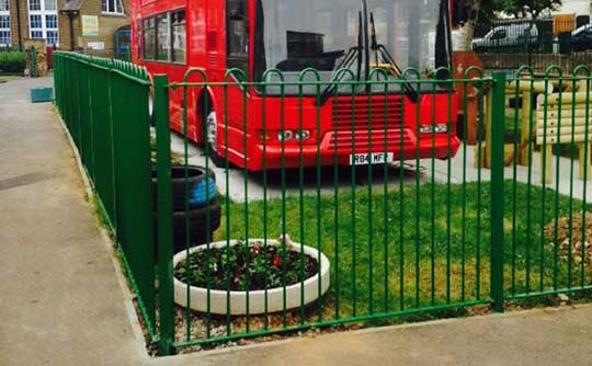 Cropped photo of converted bus to school library and powder coated ringtop fencing in leigh on sea, Essex