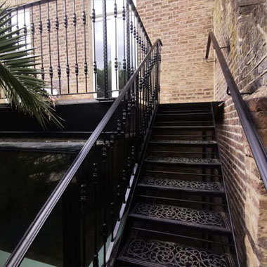 Cropped photo of decorative balcony and staircase in Kensington, London