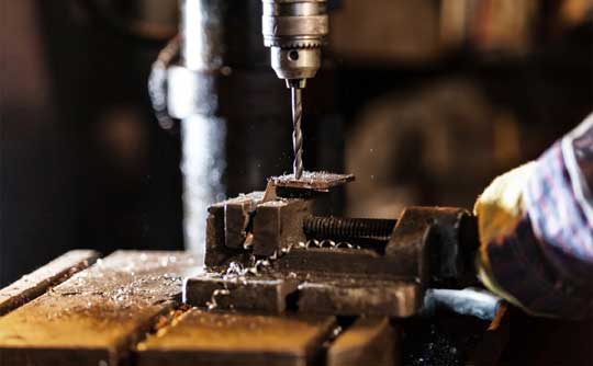 Metal drilling in the SMF workshop in Wickford, Essex