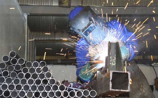MIG welding with a jig during sub-contract production 