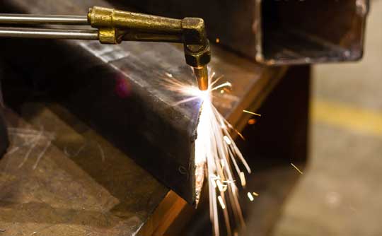 Cutting mild steel box section with oxy acetylene equipment in SMF workshop in Wickford, Essex